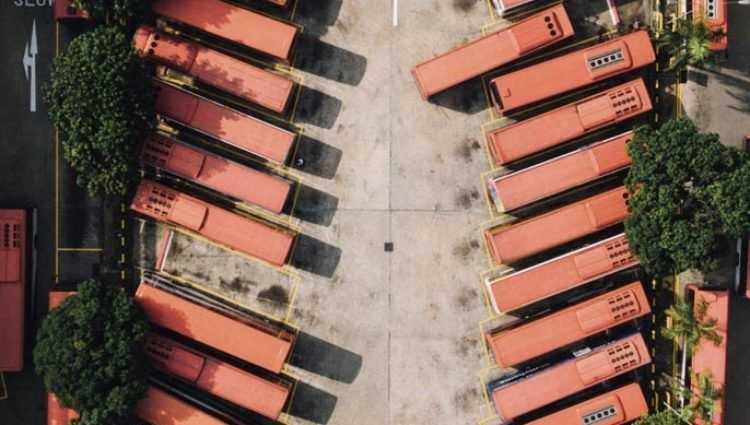 picture of buses parked at a depot